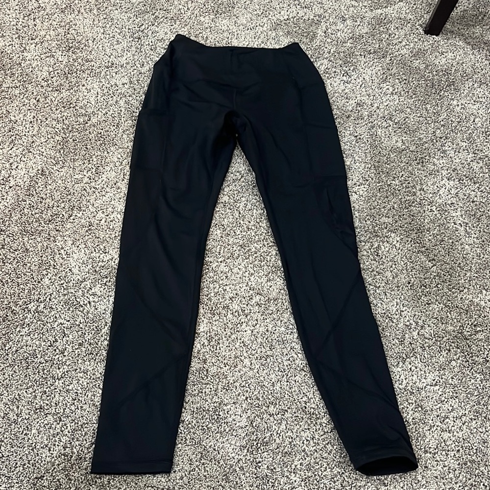 black athletic leggings size small from dri girlz with pockets and mesh under